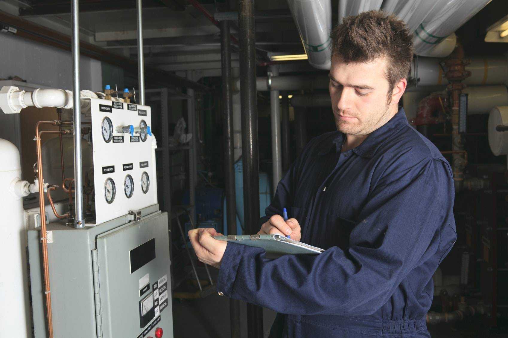 Plumber repairing an hot-water heater